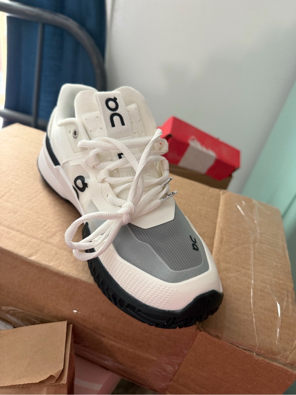 On Running White Slip-On Athletic Shoe with Black Heel Band